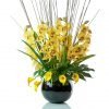 Faux Yellow cymbidium orchid display in black fishbowl