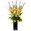Artificial yellow cymbidium orchids in black tank vase front facing
