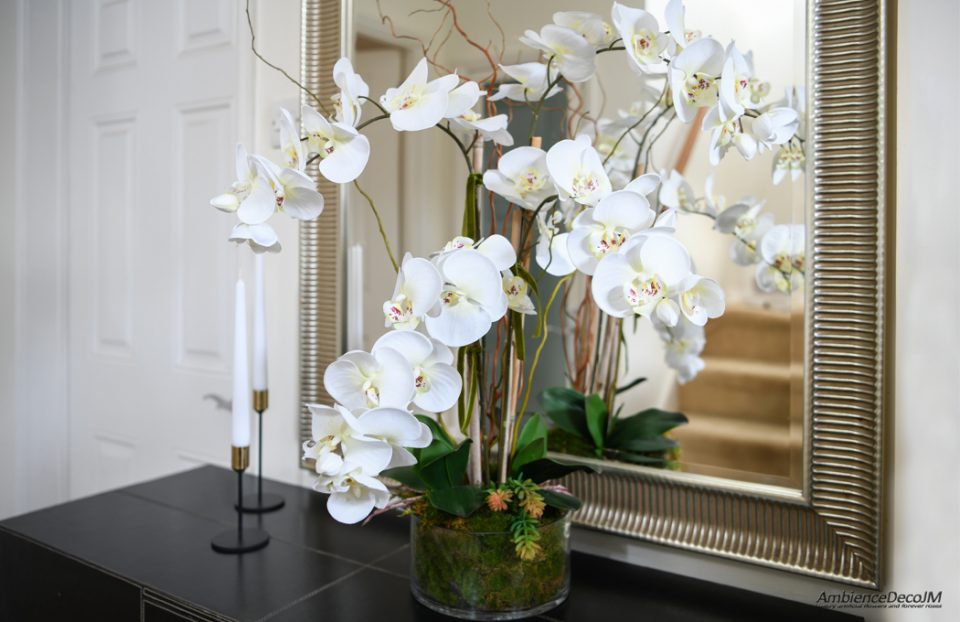 silk orchids in glass dish