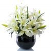 Artificial king cream lily in black fishbowl