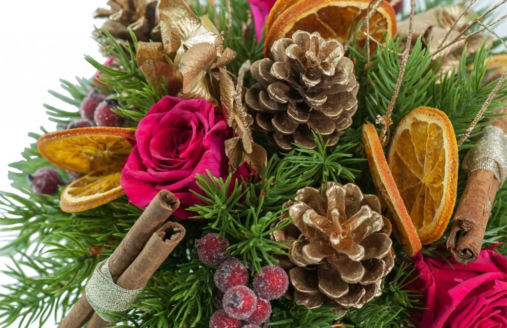Christmas centerpiece in a gold vase Preserved Floral Arrangements