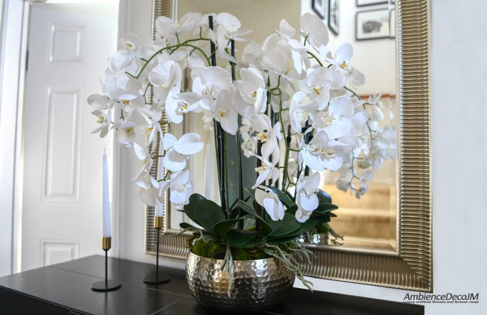Orchids in a gold dimpled bowl