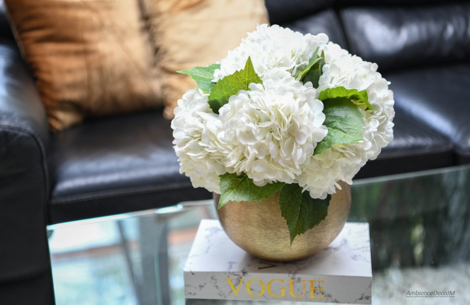 Realistic hydrangeas in a gold vase