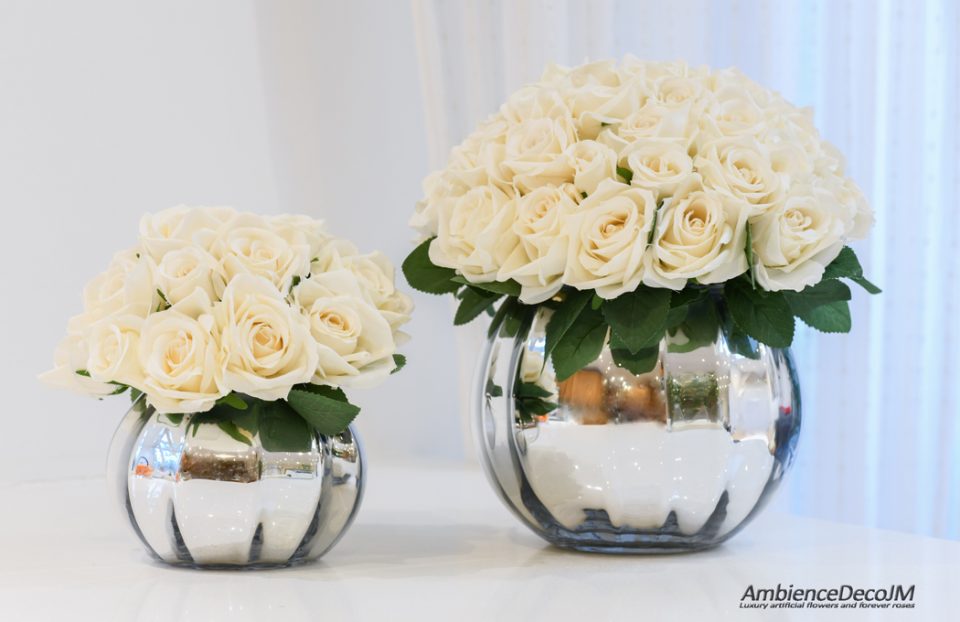 Silk roses in fishbowl vase