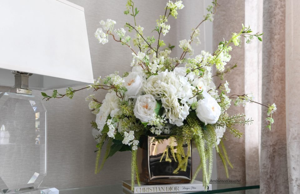 Luxury white real-touch Austin roses and hydrangeas with decorative blossom branches in a gold glass cube vase.
