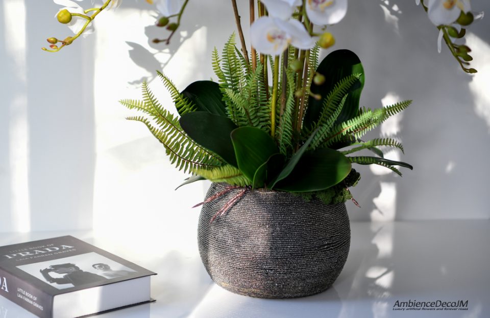Lifelike orchids in a beaded pot
