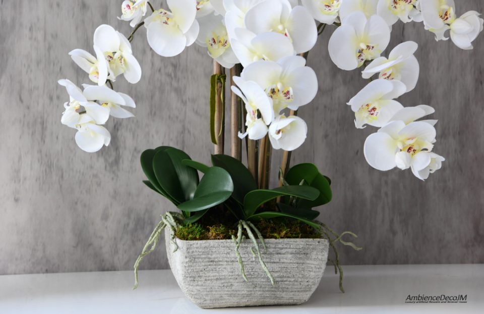Silk orchids in a concrete pot