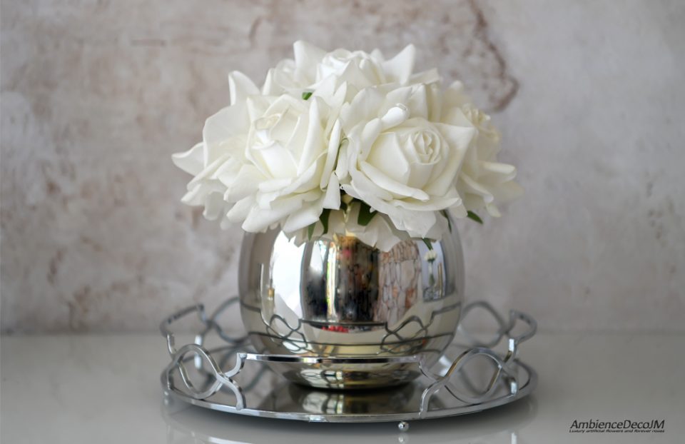 Real touch white roses in a vase