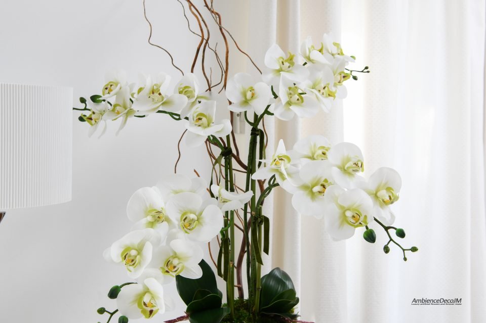 Realistic orchids in a glass bowl