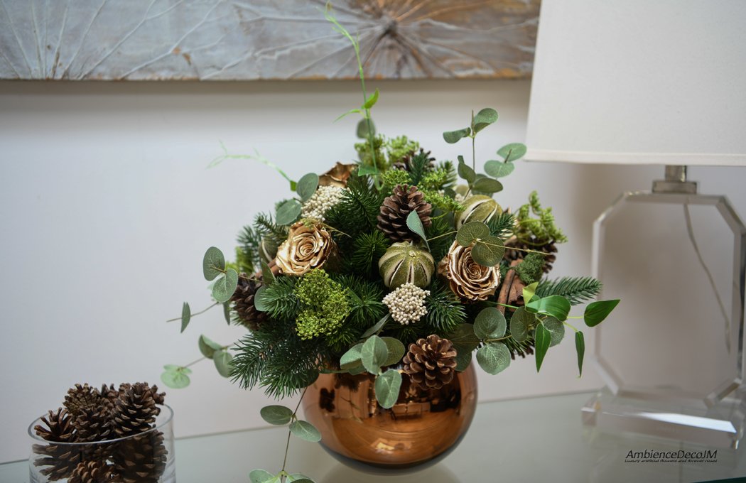 Christmas arrangement in a gold fishbowl