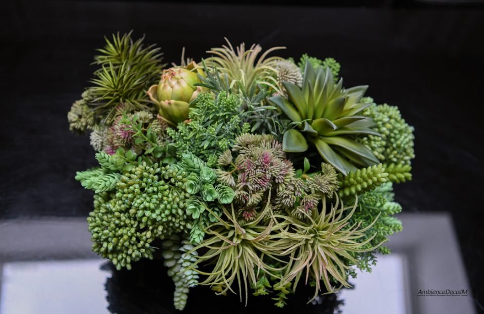 Artificial succulent arrangement in a trough