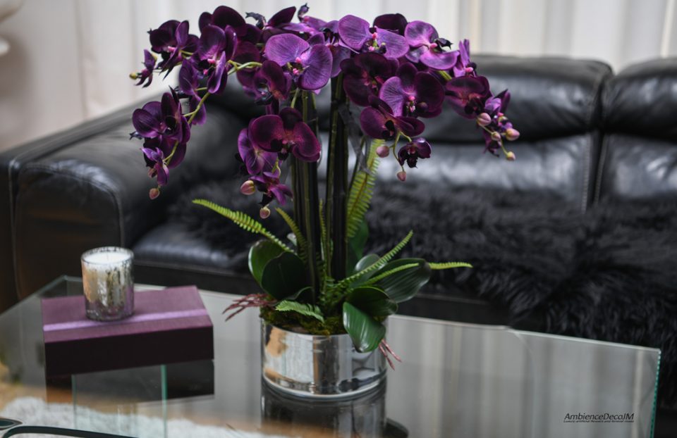 Purple Orchid arrangement in a silver vase