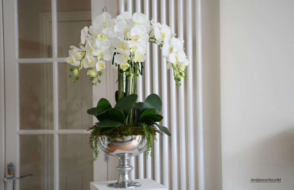 Silk orchids in a pedestal bowl