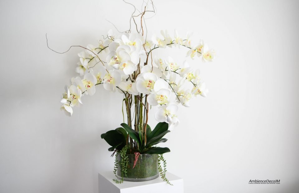 Silk orchid arrangement in moss bowl