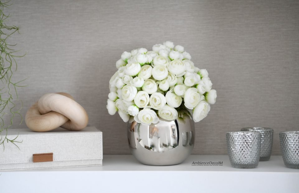 Luxury white ranunculus arrangement in a polished silver vase for elegant home décor