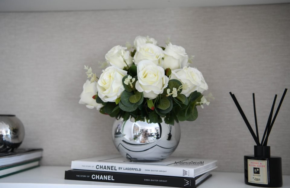 Luxury white silk rose arrangement with eucalyptus foliage in a polished silver vase for elegant home décor